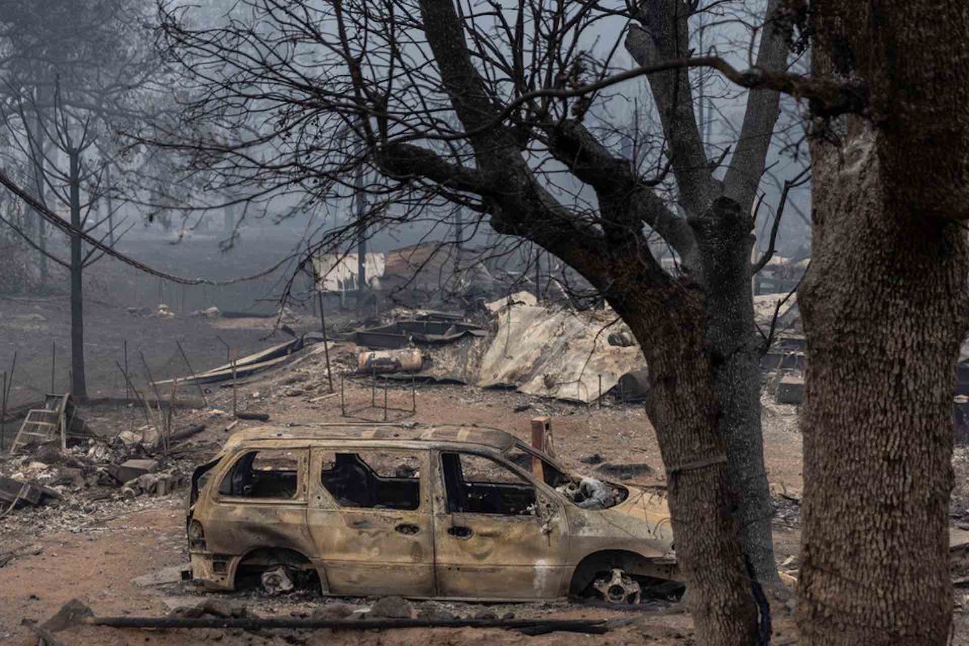 A forest fire in California kills two people, as rainfall helps put out the flames